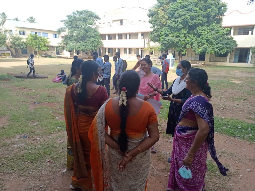 A teacher supporting students during a school learning activity