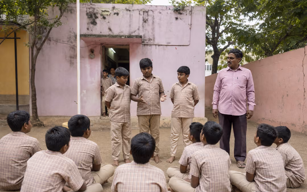Students presenting a leadership activity to their classmates in a school courtyard